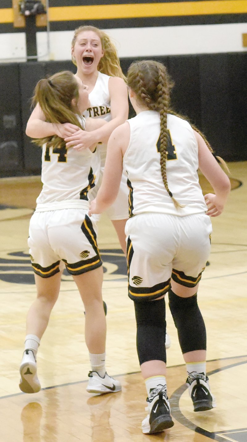 Holley Johnson hoists Maddie Jacque after Jacque’s last-second shot provided the one-point margin of victory.